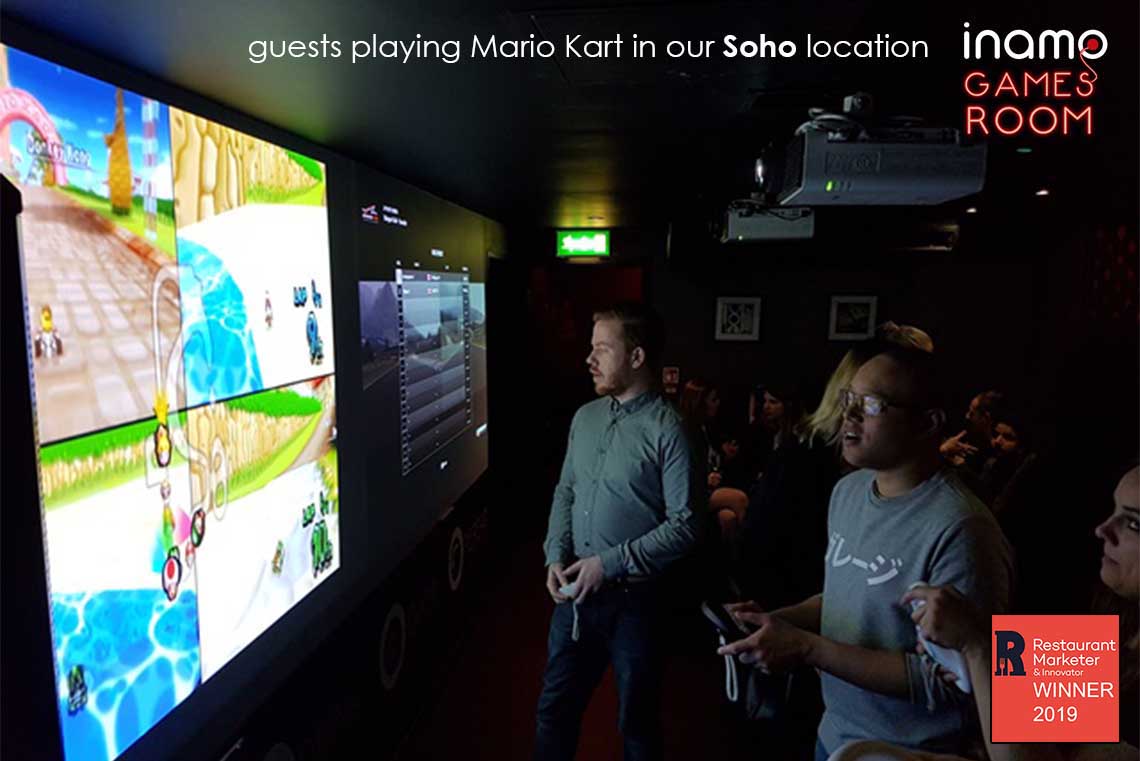 Playing Mario Kart in the Inamo Games Room
